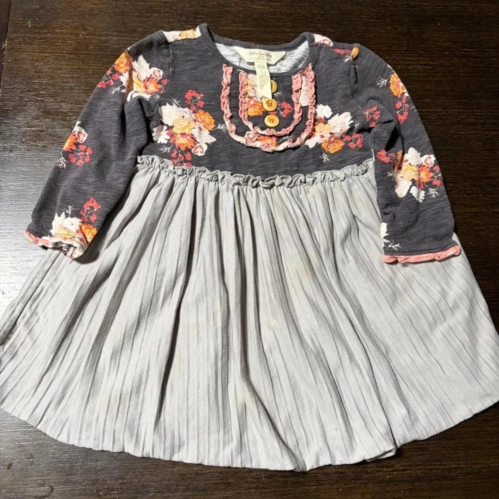 Multicoloured floral babydoll dress with ruffles and buttons. Size: 18-24M